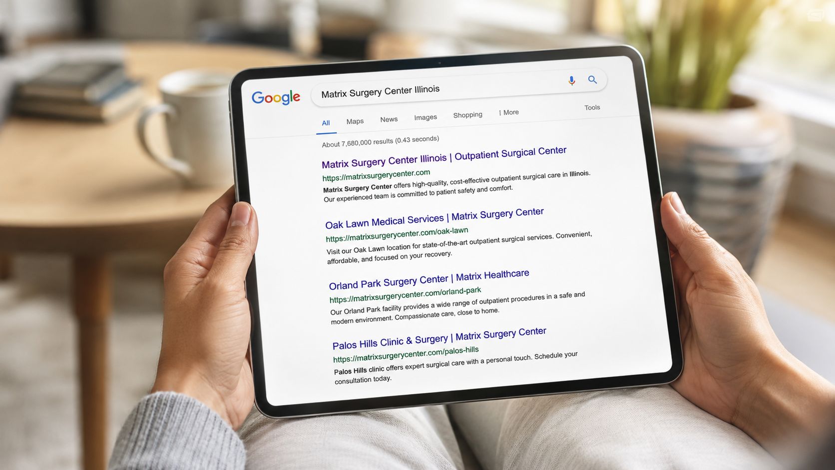 A person holding a tablet displaying Google search results for Matrix Surgery Center in Illinois.